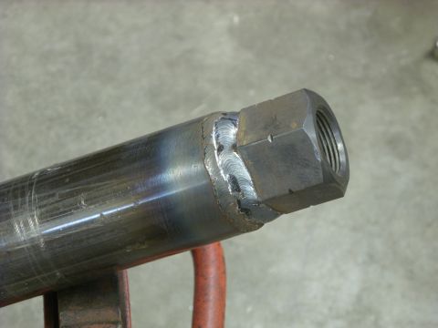 1967 Ford F-250 - Metal pipe with a nut welded to the end, showing weld details.