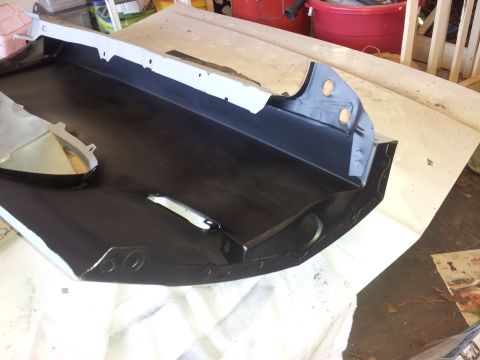 1976 Ford Ranchero - This is a metal automotive part, likely a frame section, painted black.