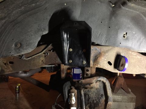 1994 Ford Bronco - Close-up of vehicle frame and suspension components, showing a newly installed bracket.