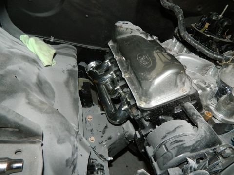 1979 Ford Bronco - Close-up of a Ford V8 engine, showing chrome valve covers and exhaust components.