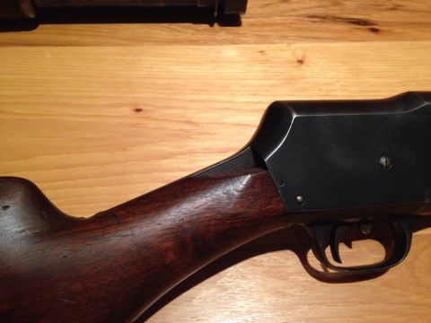 1996 Ford Bronco - Close-up view of a shotgun's wooden stock and metal receiver.