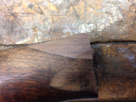 1996 Ford Bronco - Detail of wood trim on a surface, showing grain and wear.