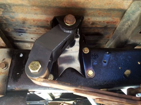 1977 Ford F-350 - Underside view of a truck's rear suspension system, focusing on a specific component.