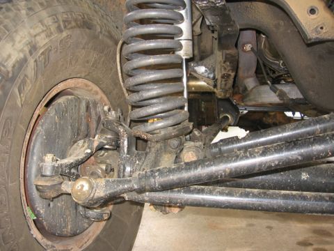 1988 Ford Bronco - This image shows the suspension system and tire of a vehicle, not a specific model year.