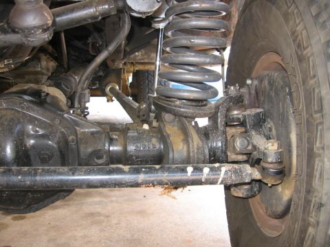 1988 Ford Bronco - This image shows the suspension and axle of a vehicle, with "SUPERMOTORS.NET" visible at the bottom.
