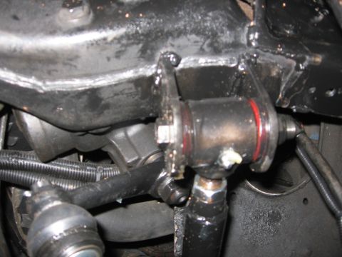 1988 Ford Bronco - Underside view of a vehicle's steering mechanism, showing various metal components and hoses.