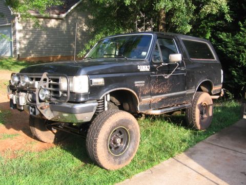 1988 Ford Bronco - This lifted 1988 Ford Bronco is ready for off-road adventures, sporting a look with mud on its body.
