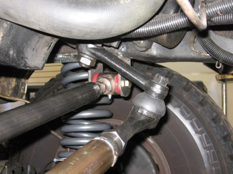 1988 Ford Bronco - Undercarriage view shows steering linkage and coil spring assembly.