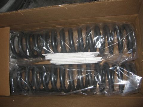 1988 Ford Bronco - New suspension coil springs are shown inside their shipping box.