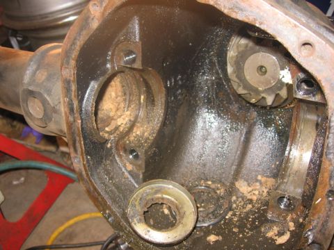 1988 Ford Bronco - Close-up view of a differential housing, showing internal gears and accumulated dirt.