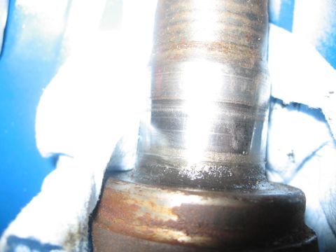1988 Ford Bronco - A close-up view of a metal shaft showing significant wear marks and rust, with a SuperMotors.net watermark visible.