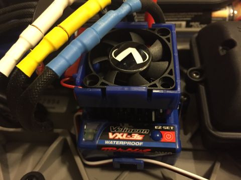 2014 Dodge 1500 - Close-up of a Traxxas Velineon VXL-3s waterproof electronic speed controller, a cooling fan and colorful wires.