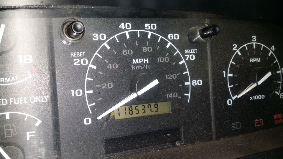 Dashboard gauges with odometer reading 118537.9