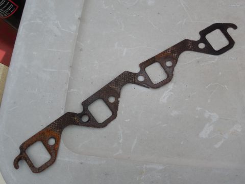 1993 Ford Bronco - This gasket was installed when the reman engine went in, and although it doesn't appear to be leaking like the R side did, it was just a ma…