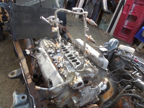 1993 Ford Bronco - It's much easier to get the rail out after the distributor is gone. I prefer to keep the injectors in the rail to keep fuel from dumping ou…