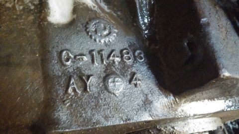 1995 Ford Bronco - Close-up of a cast iron part showing the casting numbers C-11483 AY 4.