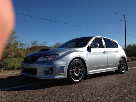 2005 Audi S4 - A silver Subaru WRX hatchback is parked on a gravel road under a clear blue sky.