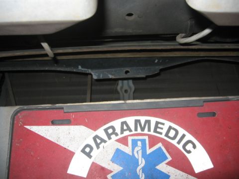 1988 Ford Bronco - A close-up view of a "PARAMEDIC" license plate, showing the Star of Life emblem.
