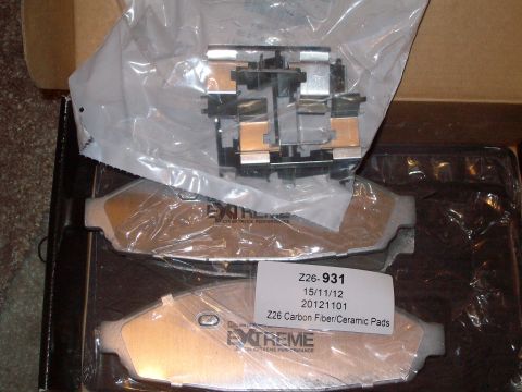 2004 Ford Crown Victoria - New brake pads are packaged in a box, ready for installation.