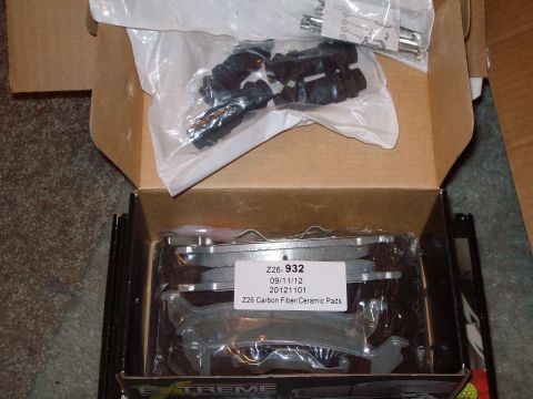 2004 Ford Crown Victoria - New brake pads and hardware kit are shown in their packaging.