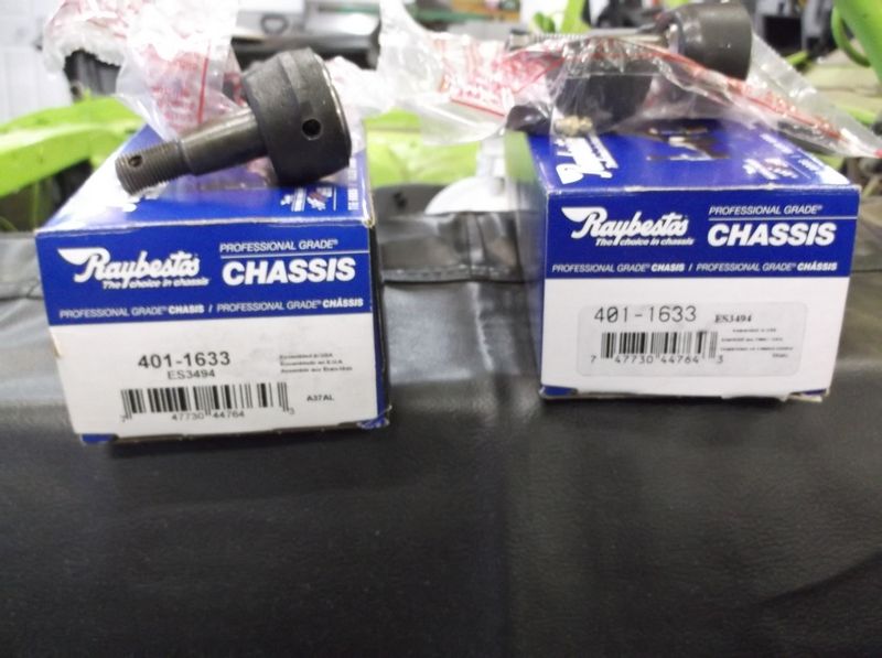 Two Raybestos Chassis ball joint boxes, part number 401-1633, with one ball joint visible on top of the left box