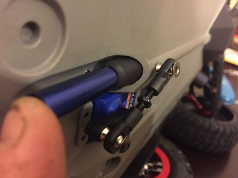 2014 Dodge 1500 - Detail of a remote-controlled car's steering or suspension mechanism, showing linkages and a shock absorber.