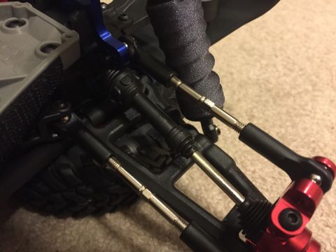 2014 Dodge 1500 - Detail of a remote control car's suspension system, adjustable tie rods and shock absorbers.