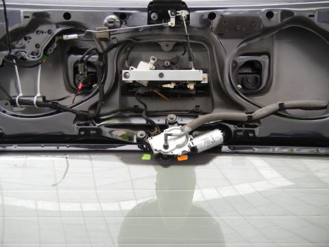 2003 Audi A6 - The interior of a trunk lid shows the latch mechanism and motor assembly.