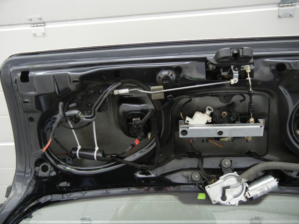 car trunk latch mechanism with wires and motor