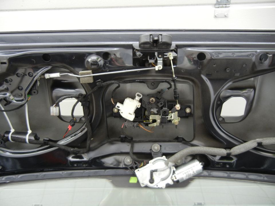 Trunk latch mechanism with wiring and motor