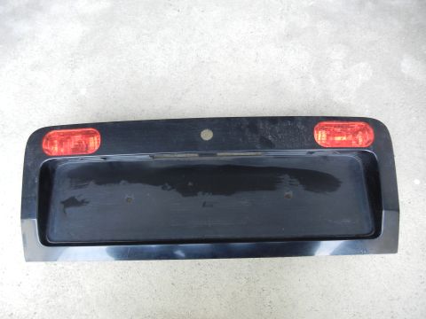 2003 Audi A6 - This is a rear license plate bezel with integrated red lights, not a 2003 Audi A6.