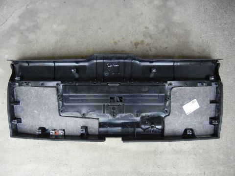 2003 Audi A6 - The underside of a vehicle's rear bumper trim piece is shown, sound dampening material and various mounting points.