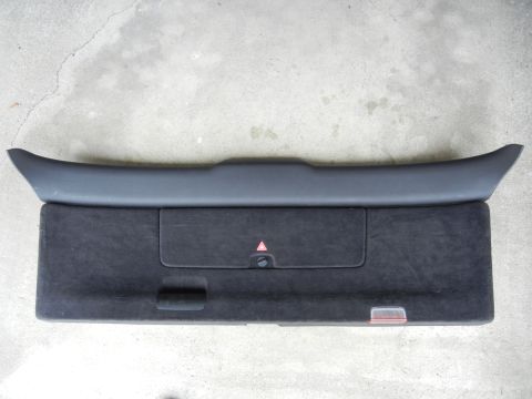 2003 Audi A6 - Trunk trim panel with integrated storage compartment and warning reflector.