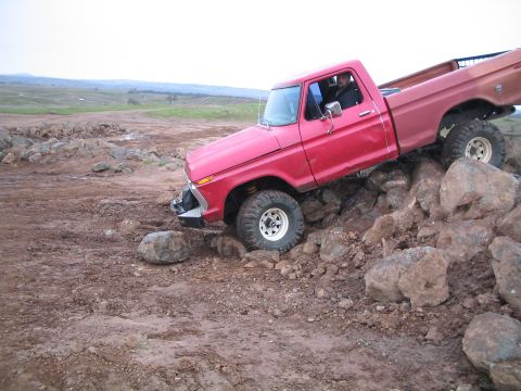 1976 Ford F-100 - 1976 Ford F-100 navigating a challenging rocky obstacle course.