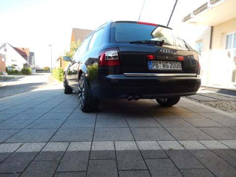 2003 Audi A6 - Rear view of a black 2003 Audi A6 wagon parked on a paved driveway.