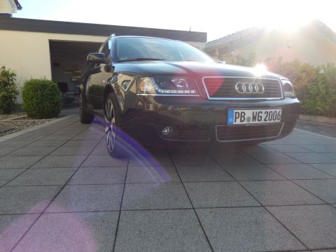 2003 Audi A6 - A black Audi A6 is parked in front of a garage, with the license plate clearly visible.