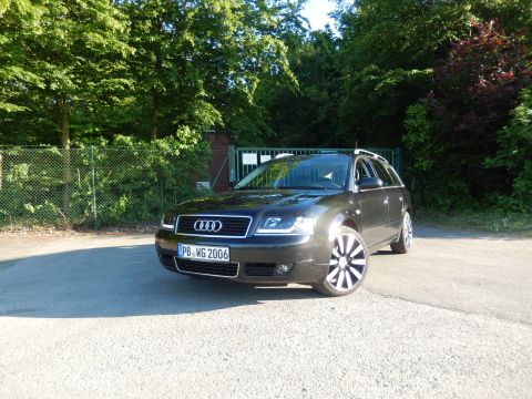 2003 Audi A6 - This dark station wagon, identified by its license plate PB WG 2006, is parked outdoors with trees in the background.