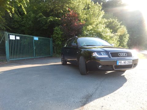 2003 Audi A6 - A black station wagon is parked next to a green gate on a sunny day. The license plate reads PB WG 2006.