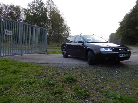 2003 Audi A6 - A black 2003 Audi A6 Avant is parked near a gate with 'Tor 8' sign.