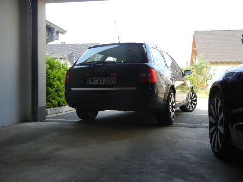 2010 Audi A4 - Black Audi wagon parked in a driveway, license plate indicates 2006 model year.
