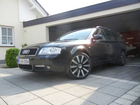 2010 Audi A4 - This black Audi wagon, identified by its license plate PB WG 2006, is parked in a driveway.