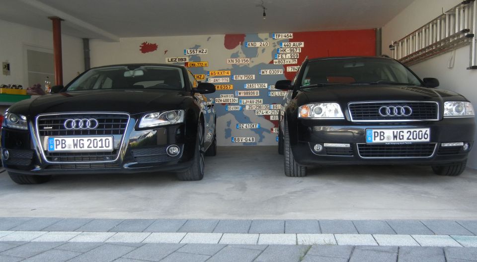 Front view of a black Audi with license plate PB WG 2010