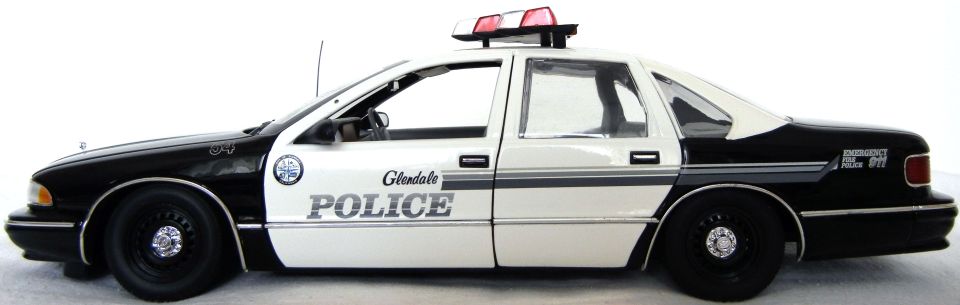 Side view of a black and white police car with "Glendale POLICE" text