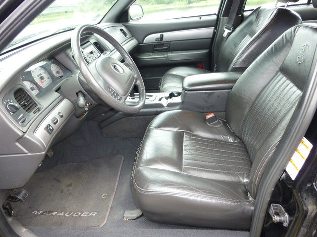 2003 Mercury Marauder interior with black leather seats, dashboard, and steering wheel