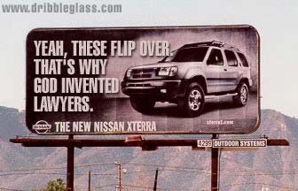 1990 Ford Bronco - Billboard promoting the Nissan Xterra, the slogan 'Yeah, these flip over that's why God invented lawyers.'