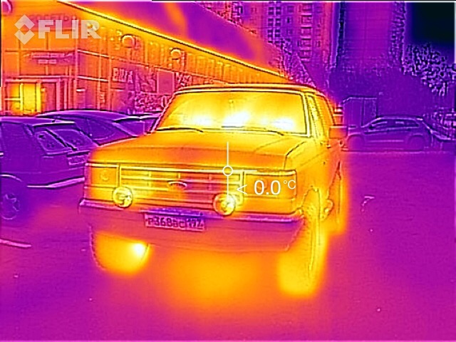 Front view of a yellow 1987 Ford Bronco with thermal imaging