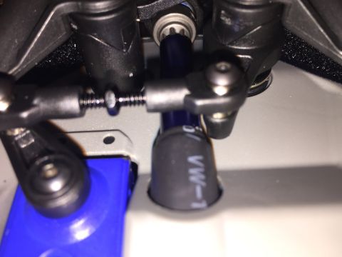 2014 Dodge 1500 - Detail of the steering mechanism, showing linkages and a blue component.