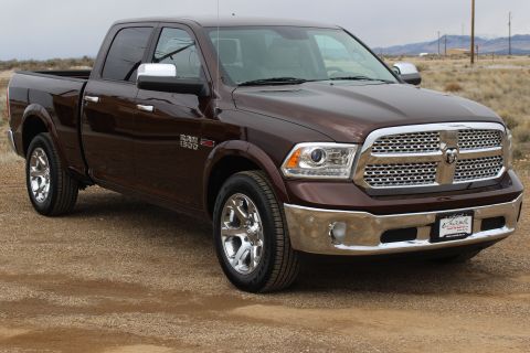 2015 Dodge 1500 - This brown 2015 Dodge 1500 pickup truck is shown from a three-quarter front perspective.