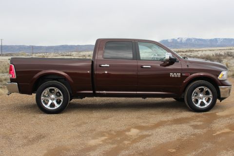 2015 Dodge 1500 - Brown 2015 Dodge Ram 1500 pickup truck shown from the side.