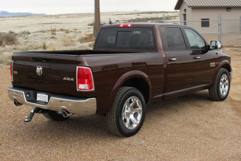 2015 Dodge 1500 - This Ram 1500 pickup truck is shown from the rear three-quarter angle, parked outdoors.